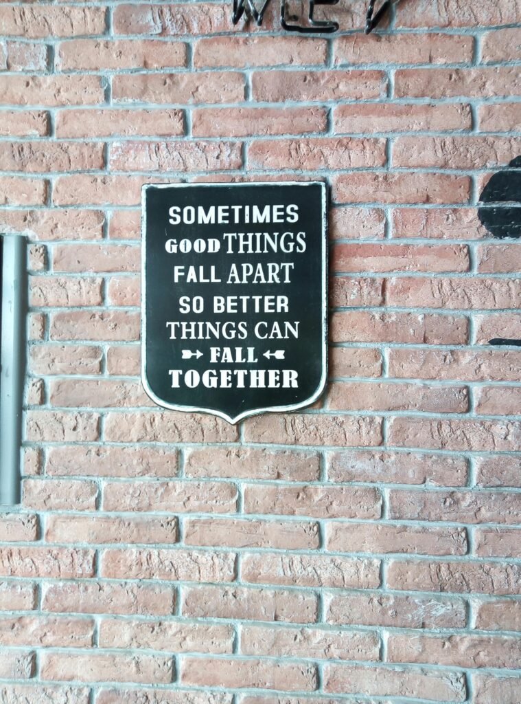 pexels-photo-13079866-13079866 Inspirational wall decor on brick wall with motivational message in black and white.